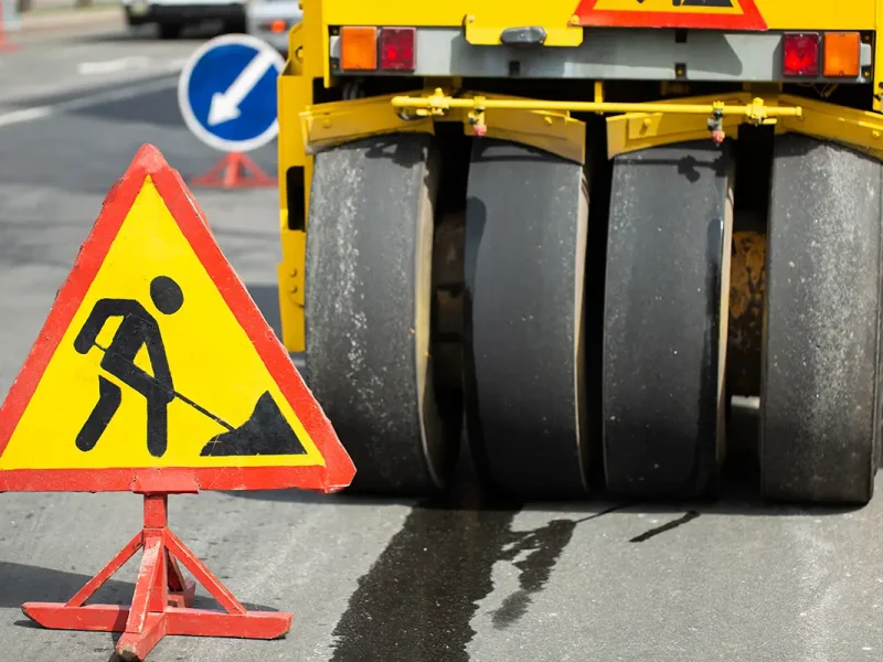 Steamroller flatten out the asphalt